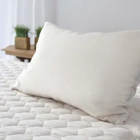 This pillow is made from soft silky kapok covered in organic cotton sateen. Kapok is a silky fiber, and feels much like milkweed or down. It is harvested from the seed pods of a kapok tree (the tree is never cut down). This natural pillow will compress with use but can be placed dry in a hot dryer for 10 minutes to help plump the pillow. This is our softest feeling pillow. Comes with a zipper so you can add or remove filling.