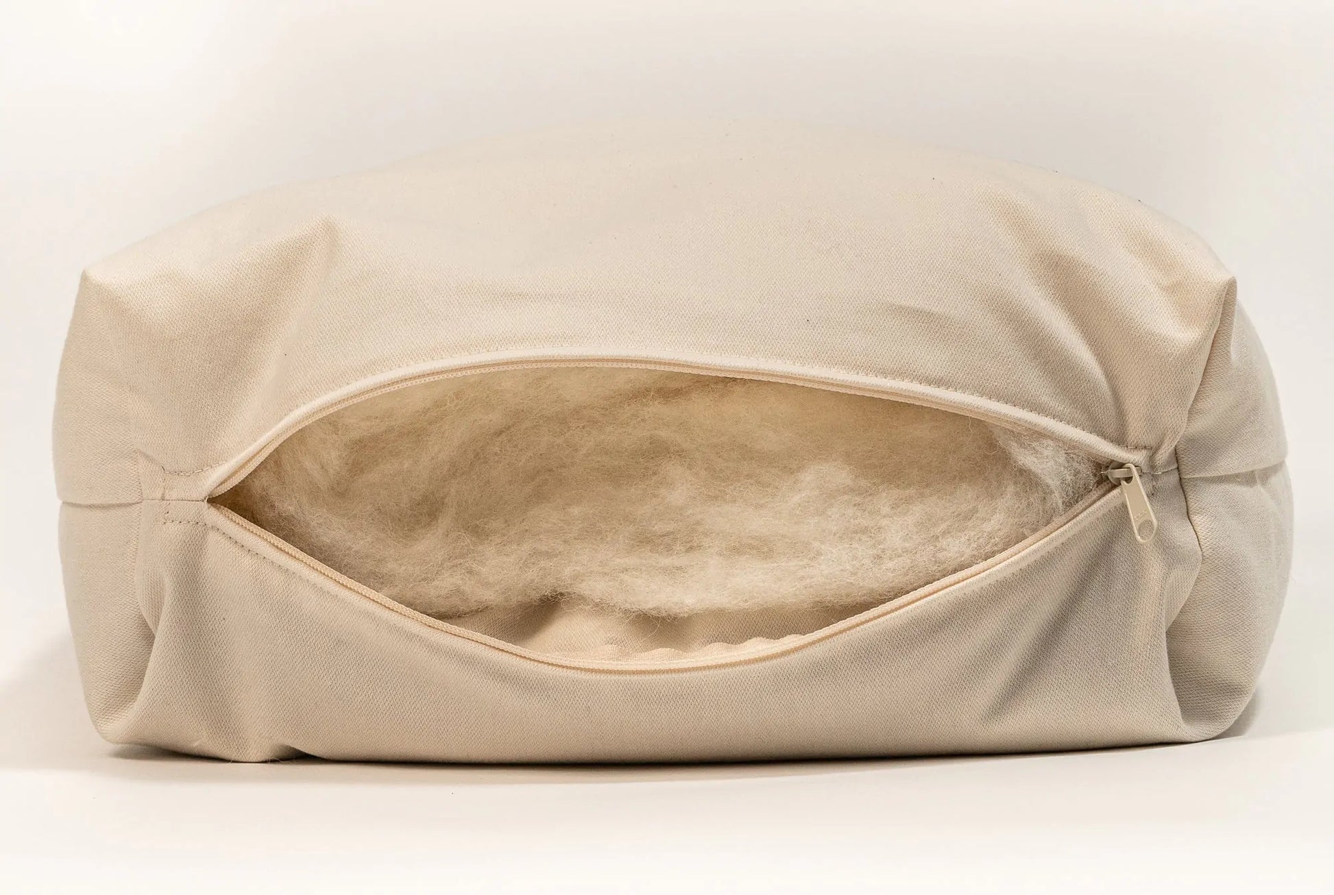 Made with a unique patented dual chamber design, one side of the Sachi Organics Rejuvenation pillow has a zipper where you can add or remove the organic millet or organic buckwheat filling and the other side of the pillow has a zipper where you can access the eco wool. The zippered cover is made from organic cotton sateen.  Being able to customize the loft by adding or removing filling makes this adjustable pillow ideal for just about everybody.  Buckwheat and Millet provide excellent neck and head support,