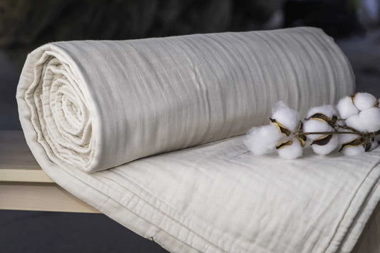 Indulge in the ultimate comfort with our organic blanket, crafted from four layers of luxurious double gauze GOTS-certified organic cotton muslin. Uniquely designed for breathability and softness, it’s free of harmful chemicals and dyes, ensuring a soothing and safe sleep environment. With a relaxed, crinkled style, this blanket offers exceptional airflow and becomes even softer and cozier with each wash. Choose from four delightful color options to suit your style and enhance your bedding ensemble.