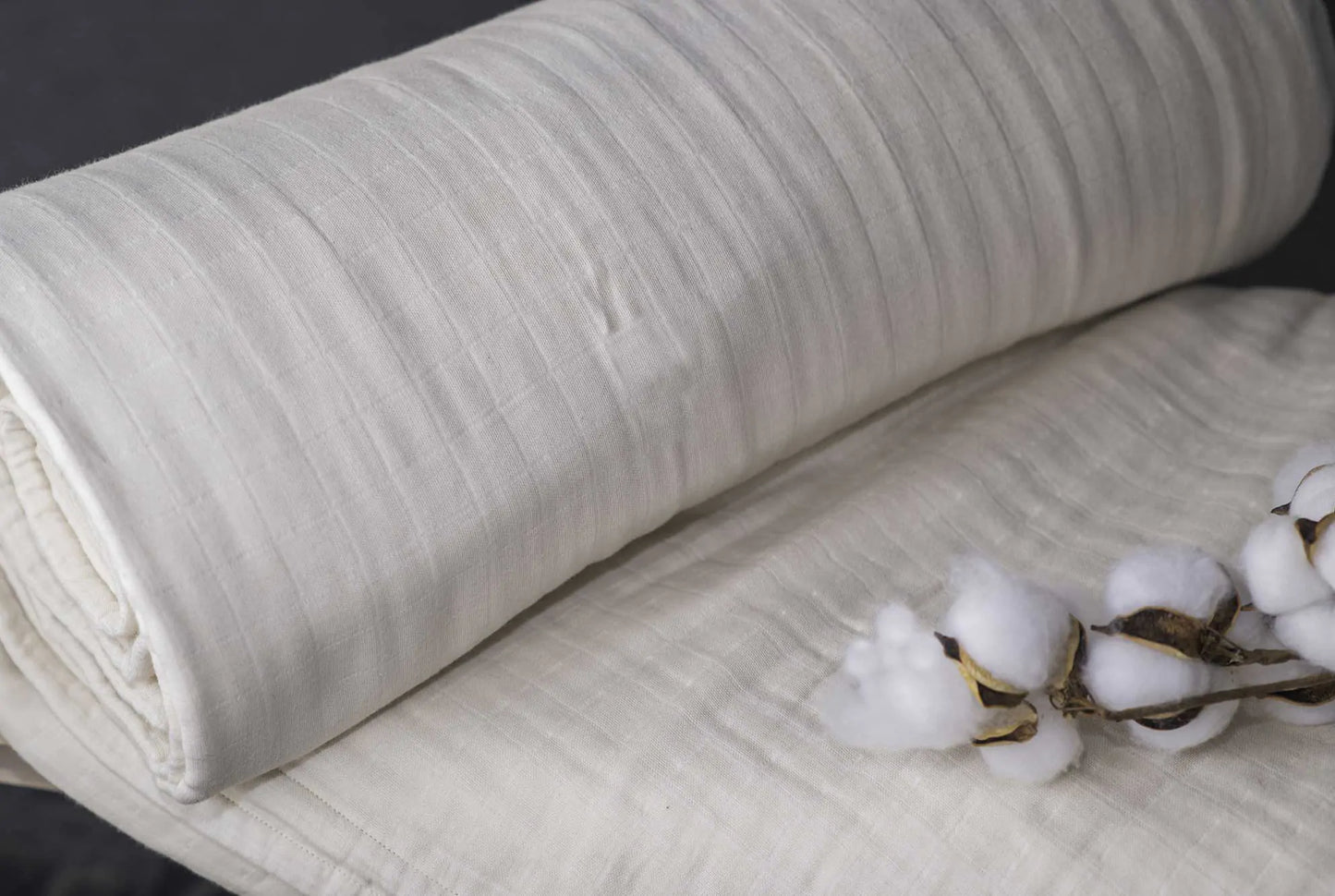 Indulge in the ultimate comfort with our organic blanket, crafted from four layers of luxurious double gauze GOTS-certified organic cotton muslin. Uniquely designed for breathability and softness, it’s free of harmful chemicals and dyes, ensuring a soothing and safe sleep environment. With a relaxed, crinkled style, this blanket offers exceptional airflow and becomes even softer and cozier with each wash. Choose from four delightful color options to suit your style and enhance your bedding ensemble.