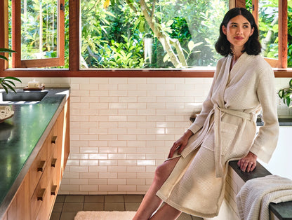 An airy waffle weave wraps you in the natural comfort and performance of premium organic cotton. Pre-tumbled to be soft from day one, this elevated spa robe feels light and breathable, growing more supple with every wash. Unisex styling creates a streamlined fit that adjusts with double belt-loops and a self-tie. Spacious patch pockets at hip.