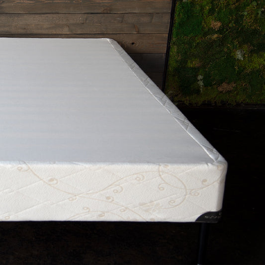 Designed to be used with our latex mattresses, but not required if you have a slatted bed frame. The Upholstered Wood Slat Foundation provides extra support for our heirloom quality heavier mattresses and is 9" High. Solid wood slats are upholstered following traditional European design and covered our quilted organic cotton ticking. Our foundations comply with FR1633 and are fitted with metal corner guards to prevent corner damage and give our beds a finished look. 