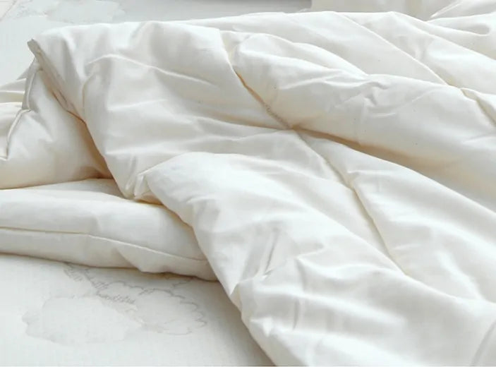 This lightweight comforter provides the perfect amount of comfort for sleeping in all seasons or for those who don't need much help keeping warm. The soft sateen cover features 100% GOTS Certified organic cotton quilted to our own American Dream Wool™ from local US farms. This comforter is made with super-washed wool, which allows it to be machine washed in cold without clumping or felting. For best results wash only if needed in cold on delicate and dry flat. You may also tumble dry on air dry or low heat.