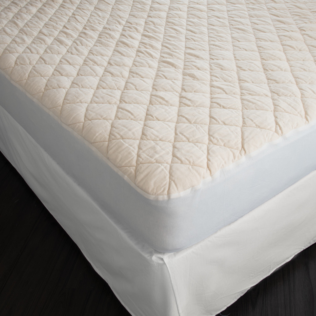 The washable wool mattress pad is made of our American Dream Wool and quilted using organic cotton on both sides. It provides excellent protection to your mattress. The washable wool pad is skirted with organic cotton knit and features an 18" pocket. It will keep your mattress looking newer longer. Made in the USA.