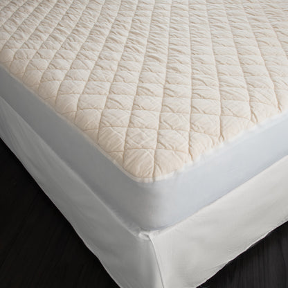 The washable wool mattress pad is made of our American Dream Wool and quilted using organic cotton on both sides. It provides excellent protection to your mattress. The washable wool pad is skirted with organic cotton knit and features an 18" pocket. It will keep your mattress looking newer longer. Made in the USA.